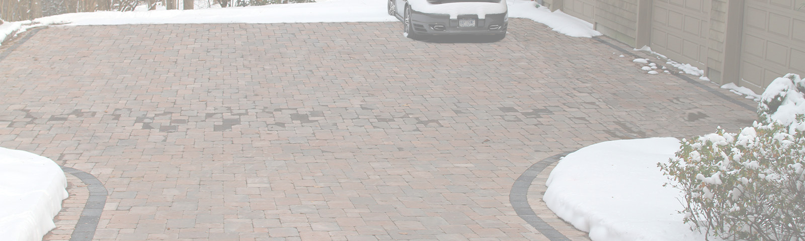 A heated paver driveway after a snowstorm.